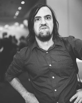 Dan in black and white looking really angry