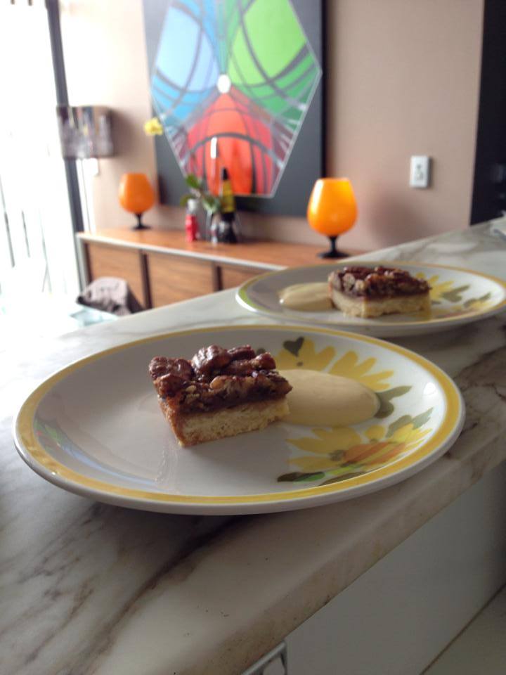 A tastefully laid table setting with some plates of pecan slice